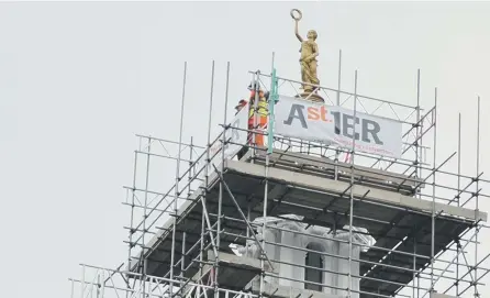  ??  ?? The Terpsichor­e statue is put back into place on the Sunderland Empire roof.