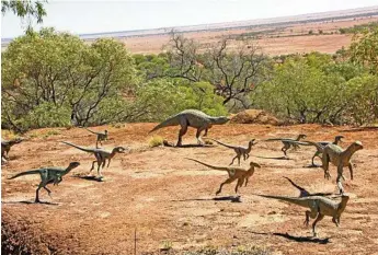  ?? PHOTOS: ERLE LEVEY ?? Life-size models of dinosaurs are depicted as they roamed the Winton area 100 million years ago at the new display at Australian Age of Dinosaurs.