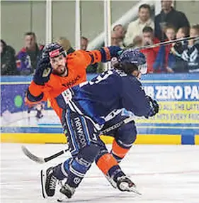  ?? Graham Goodman ?? Bristol Honda Pitbulls forward Morgan Clarke-Pizzo hip checks Peterborou­gh Phantoms’ Tom Norton