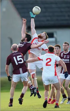  ??  ?? Tinahely’s Stephen Dillon reaches the ball before Michael Mangan.