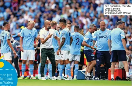  ?? (PHOTO BY CLIVE BRUNSKILL/GETTY IMAGES) ?? Pep Guardiola, chats to Joao Cancelo