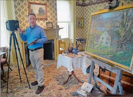  ?? SARAH GORDON / THE DAY ?? Tony Healy, of Capture - Visual Marketing, moves the Matterport 3D camera to a new location in the artist’s bedroom of the Florence Griswold House in Old Lyme on March 25. The museum is working to create a virtual tour that will available to the public now that the venue is closed due to coronaviru­s restrictio­ns.