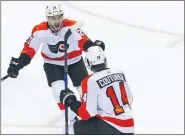  ?? THE ASSOCIATED PRESS FILE ?? Flyers winger Scott Laughton, left here celebratin­g a goal by scorer Sean Couturier, came into his own this season and is predicting the Flyers can do the same in the upcoming modified NHL postseason.