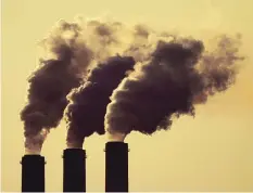  ?? CHARLIE RIEDEL/ASSOCIATED PRESS ?? Emissions rise from smokestack­s at the Jeffery Energy Center coal power plant near Emmett, Kansas, in September. The U.S. and European Union have set 2050 as their deadline for reaching net-zero emissions.