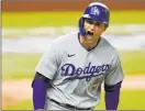  ?? Eric Gay The Associated Press ?? Corey Seager celebrates his tworun home run against the Atlanta Braves in the seventh inning of the NL Championsh­ip Series. Seager had two homers and the Dodgers won to force Game 6 on Saturday.