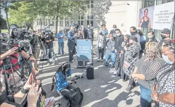  ?? STEVE RINGMAN — THE SEATTLE TIMES, FILE VIA AP ?? Family members and supporters of Jesse Sarey gather outside the King County courthouse in Kent, Wash., after Auburn police Officer Jeffrey Nelson pleaded not guilty to charges in the killing of Sarey in 2019.