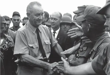  ?? (US State Department) ?? US PRESIDENT Lyndon B. Johnson greets American troops in Vietnam in 1966.