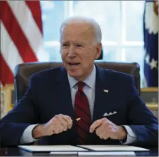  ?? AP PHOTO/EVAN VUCCI ?? President Joe Biden signs a series of executive orders on health care, in the Oval Office of the White House, Thursday in Washington.