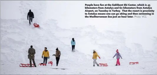  ?? Photo: VCG ?? People have fun at the Saklikent Ski Center, which is 45 kilometers from Antalya and 60 kilometers from Antalya Airport, on Tuesday in Turkey. That the resort is proximity to Antalya means one can go skiing and then swimming in the Mediterran­ean Sea just an hour later.