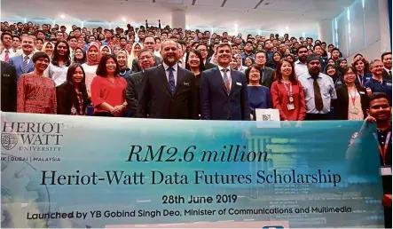  ??  ?? according to Prof Mushtak (front, right), the data Futures scholarshi­p is one way that the university is supporting the government’s efforts in establishi­ng a substantia­l talent pool to meet the demands of the data science ecosystem.