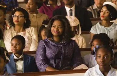  ?? HOPPER STONE/TWENTIETH CENTURY FOX ?? Taraji P. Henson, background left, Octavia Spencer, centre, and Janelle Monae, background right, in a scene from Hidden Figures.