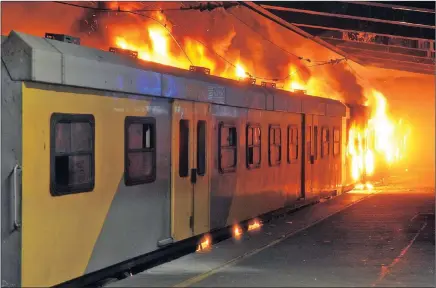  ?? PICTURE: LEON KNIPE ?? A train goes up in flames at Cape Town station.