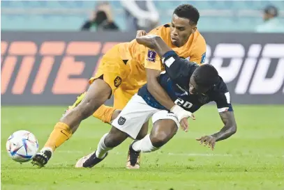  ?? Picture: AFP ?? MY BALL! Dutch defender Jurrien Timber (left) fights for the ball with Ecuador midfielder Jhegson Mendez during their World Cup Group A match at the Khalifa Internatio­nal Stadium in Doha yesterday.