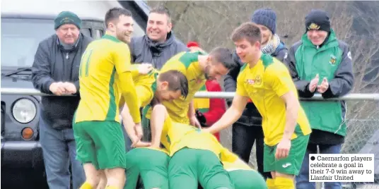  ??  ?? ● Caernarfon players celebrate a goal in their 7-0 win away to Llanfair United