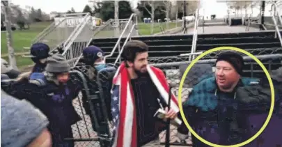  ?? U.S. DISTRICT COURT RECORDS ?? Prosecutor­s say this photo shows Daniel Leyden helping to break through a barricade near the U.S. Capitol on Jan. 6, 2021. Leyden admitted he was among the first set of rioters to try to break through a barricade of bike racks.