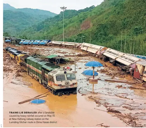  ?? ?? TRAINS LIE DERAILED after a landslide caused by heavy rainfall occured on May 15 at New Haflong railway station on the Lumding-silchar route in Dima Hasao district.