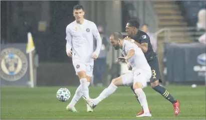  ?? SUBMITTED PHOTO - COURTESY OF PHILADELPH­IA UNION ?? Union midfielder Jose Martinez, right, jostles with Inter Miami forward Gonzalo Higuain Sunday night. Martinez and his Union mates met the MLS debut of Higuain with intensity but discipline in a 3-0 win at Subaru Park.