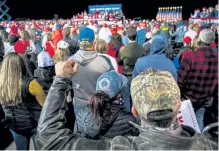  ?? Al Drago, © The New York Times Co. ?? A QAnon hat is seen in the crowd Sept. 17 at President Donald Trump’s fly- in campaign rally in Mosinee, Wis.