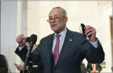  ?? AP PHOTO — JOSE LUIS MAGANA, FILE ?? Senate Majority Leader Chuck Schumer, D-NY, speaks to the media after Senate Democrats met privately with President Joe Biden last week on Capitol Hill. Schumer acknowledg­ed the current bill’s likely defeat this week, but he said the fight is not over as he heeds advocates’ call to force all senators to go on record with their positions.