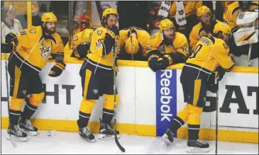  ?? The Associated Press ?? STOPPED SHORT: Nashville players react after their 2-0 home loss to the Pittsburgh Penguins in Game 6 of the NHL Stanley Cup Final Sunday night. Pittsburgh repeated as National Hockey League champion, spoiling Nashville’s most successful season.