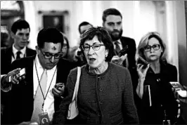  ?? AARON P. BERNSTEIN/GETTY ?? Sen. Susan Collins speaks to reporters about the bipartisan bill she’s sponsoring to protect young immigrants currently covered by the DACA program from deportatio­n.