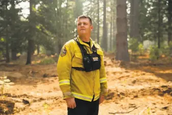  ?? Santiago Mejia / The Chronicle ?? Cal Fire Battalion Chief Sean Norman is used to battling fires, but found himself overseeing a makeshift field hospital at Station 62, where firefighte­rs and medics treated burn victims.