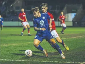  ?? ?? Jamie Cooke takes on the Aldershot defence. Pic: Marcus Branston