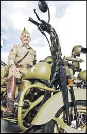  ?? Las Vegas Review-Journal file ?? World War II veteran Gene Stephens, 94, wears his Military Police Corps uniform as he poses on a vintage motorcycle at Battlefiel­d Vegas in 2012.