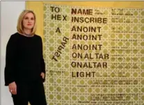  ??  ?? Lenore Lukasik-Foss, director of the Sexual Assault Centre Hamilton and Area (SACHA). She’s standing in front of “Hex To a Rapist.”