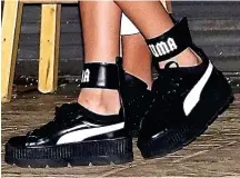  ??  ?? Sole sister: Her £150 Puma trainers with ankle cuffs