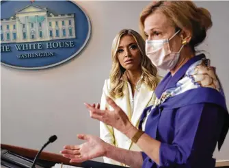  ?? Alex Wong / Getty Images ?? White House coronaviru­s response coordinato­r Deborah Birx, right, with press secretary Kayleigh McEnany, said some church leaders might want to “wait another week” to reopen.