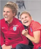  ??  ?? Izzy Christians­en’s parents and wider family captured in the video and midfielder Izzy (right) shares her delight with fellow England player Millie Bright