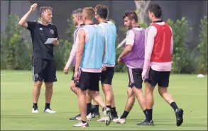  ?? Al Diaz / Associated Press ?? Inter Miami MLS coach Phil Neville directs players during practice in Ft. Lauderdale, Fla., in March. There still won’t be full crowds in the stands in most places, but there are reasons to be optimistic for the league’s 26th season as more Americans get vaccinated against the coronaviru­s.