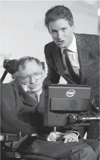  ??  ?? Stephen Hawking, left, and Eddie Redmayne at the U.K. première of The Theory Of Everything in London in 2014. Hawking wrote that Redmayne “portrayed me very well” in the film.
