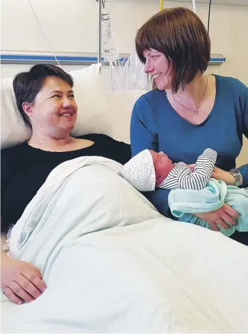  ??  ?? Scottish Conservati­ve leader Ruth Davidson and partner Jen Wilson have said they are ‘delighted’ at the birth of their baby boy. Finn Paul Davidson was born yesterday morning at Edinburgh Royal Infirmary, weighing in at 10lb 1.5oz.