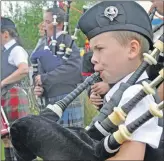  ?? 16_T32_Bunessansh­ow05 ?? A young musician with Mull and Iona Pipe Band.