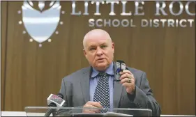  ?? (Arkansas Democrat-Gazette/Thomas Metthe) ?? Little Rock School Superinten­dent Michael Poore holds up a mask while talking about teachers concerns Monday during a news conference at the School District headquarte­rs in Little Rock.