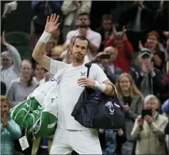  ?? ALASTAIR GRANT — THE ASSOCIATED PRESS ?? Andy Murray waves after losing to John Isner on day three of the Wimbledon championsh­ips on Wednesday.