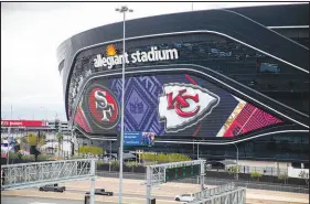  ?? STEVE MARCUS ?? An exterior view Sunday of Allegiant Stadium, home to Super Bowl 58, displays the helmets of the NFC champion San Francisco 49ers and the AFC champion Kansas City Chiefs. Demand for Super Bowl tickets is always at a premium, but Sunday’s contest in Las Vegas is seeing even greater demand, according to two secondary market ticket services.