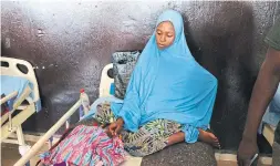  ??  ?? Hawa Modu, 18, and her 2-year-old son, Hassan — who was suffering from severe wasting and a respirator­y tract infection — at a clinic in Gajiram.
