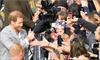  ?? PICTURE: REUTERS/AFRICAN NEWS AGENCY (ANA) ?? Britain’s Prince Harry greets well-wishers outside Windsor Castle yesterday before his wedding to Meghan Markle today in Windsor. See pages 5, 12, 18 and 19