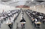  ??  ?? The school’s many matric pupils in the school hall, writing a trial examinatio­n paper.