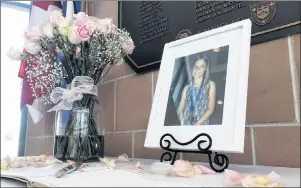  ?? CP PHOTO ?? A photograph of Julianna Kozis is seen at a memorial assembled by the city of Markham, at the Markham Civic Centre on Wednesday. The ten year-old was named Tuesday night as the second fatality in a mass shooting on the Danforth, in Toronto which happened on Sunday night.