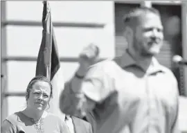  ?? Timothy D. Easley Associated Press ?? ROWAN COUNTY CLERK Kim Davis, left, attends a rally in Frankfort, Ky. She has refused to issue same-sex marriage licenses, citing her Christian faith.