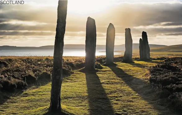  ?? FOTOLIA ?? The stones at Ring Of Brodgar cast long shadows in the evening sunlight. Unlike a visit to Stonehenge, you can get up close and personal to the 27 stones.