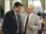  ?? RICH PEDRONCELL­I — ASSOCIATED PRESS ?? Assemblyma­n Matt Dababneh, left, talks to colleague Raul Bocanegra, who resigned last week while facing sexual harassment allegation­s.