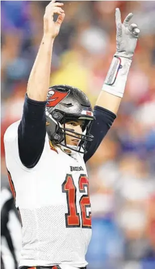  ?? ?? Tom Brady celebrates TD as he returns to New England for first time as a Buc.