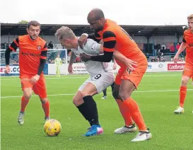  ??  ?? United’s William Edjenguele jostles for the ball at Links Park.