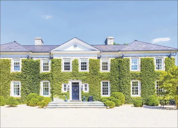  ?? Contribute­d photo ?? Listed for $7.975 million by Halstead Real Estate, the five-bedroom Georgian manor at 21 Vineyard Lane, Greenwich, is situated on 2 acres with perennial gardens, hand-carved stone pathways, a stream, and a pool terrace surroundin­g the in-ground pool and spa.