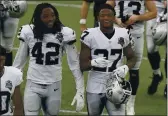  ?? STEVEN SENNE — THE ASSOCIATED PRESS, FILE ?? Raiders linebacker Cory Littleton (42) and defensive back Trayvon Mullen (27) leave the field after their game against the Patriots last Sunday in Foxborough, Mass.